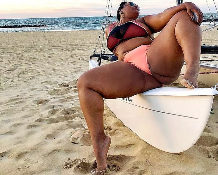 Feet In The Sand Spread Wide Open At The Beach In A Boat